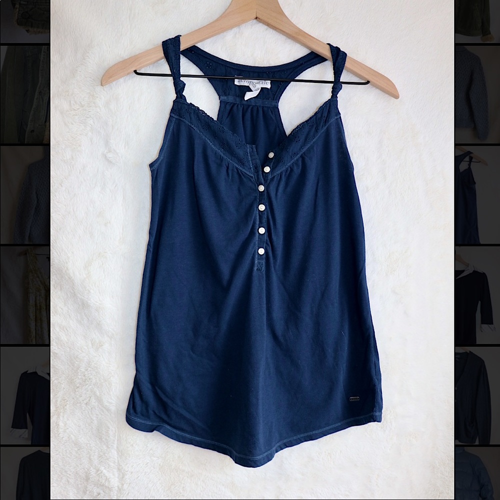 Super cute tank top with floral detailing on straps